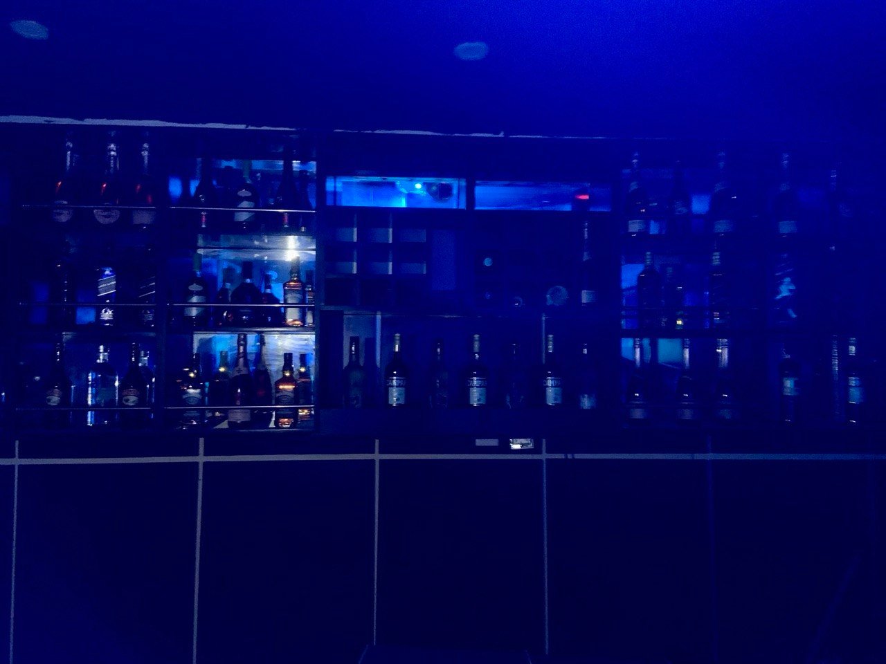 People playing snooker in a modern bar setting